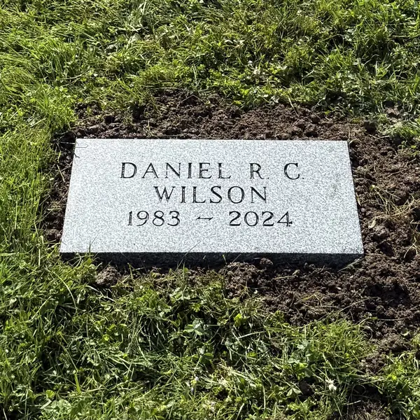 Flat granite marker — Champlain Monuments